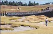  ?? Mike Ehrmann
Getty Images ?? JORDAN SPIETH walks up the 18th fairway during a practice round for the U.S. Open at Chambers Bay.