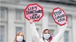  ?? REUTERS ?? People attend a protest against the impact US sanctions are having on Iran and the coronaviru­s disease worldwide this month in Washington.