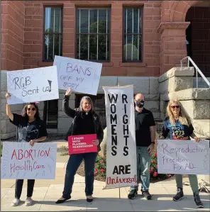  ?? (AP/Felicity Figueroa) ?? The Rev. Sarah Halverson-Cano (second from left), senior pastor of Irvine United Congregati­onal Church in Irvine, Calif., leads congregant­s May 3 during a rally supporting abortion access in Santa Ana, Calif.