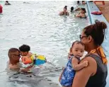  ?? Lisa Krantz / Staff photograph­er ?? Krystal and Jaime Hernandez introduce their grandsons, Zyaire Tatum, 2 months, Esaiah Tatum, 1, to the Woodlawn Lake Park Pool last week.