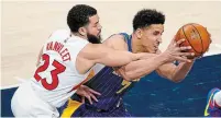  ?? MICHAEL CONROY THE ASSOCIATED PRESS ?? Raptors guard Fred VanVleet hounded the Pacers’ Malcolm Brogdon in Sunday’s game, holding one of Indiana’s top offensive threats to 5-for-22 from the field.