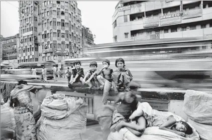  ??  ?? ‘When I was doing my second book on Kolkata, I started to notice every child in every street, these children who had no homes and no schooling, but knew the simple joys of life,’ says Raghu Rai. The photo above was taken at this time.