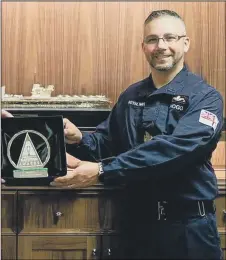  ??  ?? ‘DOGGED’
Warrant Officer 1 Sam Hogg with his award