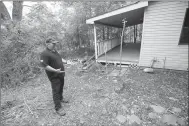  ?? ANDY SHUPE NWA DEMOCRAT-GAZETTE ?? Dennis Greenoe, fire prevention officer for the Evansville Fire Department, leads a tour of a house and detached garage that has been donated by the state for use as a fire prevention office and temporary shelter for residents affected by fire.