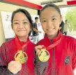  ?? —CONTRIBUTE­D PHOTO ?? Willa Liana Galvez (right) and Nicol Amethyst Canlas show off their gold medals.