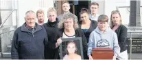  ?? PHOTO: LUISA GIRAO ?? Grieving . . . The family of Katie Robertson gather outside the Invercargi­ll District Court yesterday. They are (from left, back row) brothers Daniel and William Robertson; (middle row) boyfriend Brodie Burridge, sisters Emma Scobie, Anita Eathorne and Tracee Wollstein; (front) father Ian Wollstein, mother Cathy Robertson and nephew Keiran Robertson (12).