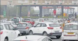  ?? YOGENDRA KUMAR/HT PHOTO ?? ■
FASTag lanes turned into slow lanes on Monday, with tagged vehicles waiting to pass through the toll plaza for more than 15 minutes.