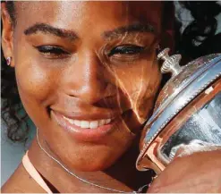  ??  ?? PARIS: In this June 6, 2015, file photo, Serena Williams, of the United States, holds the trophy after winning the final of the French Open tennis tournament against Lucie Safarova, of the Czech Republic, at the Roland Garros stadium, in Paris. For the...