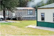  ??  ?? A metal building and several mobile homes occupy the property of the DARP Foundation facilities near Tahlequah.