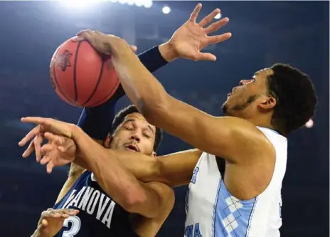  ?? BOB DONNAN/USA TODAY SPORTS ?? Villanova’s Josh Hart and North Carolina’s Kennedy Meeks fight for a rebound in the NCAA title game. For full coverage, visit thestar.com or Star Touch.