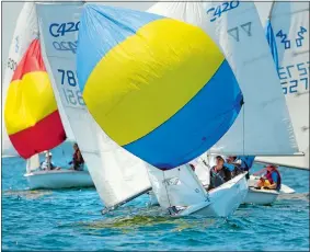  ?? TIM MARTIN/THE DAY ?? Crew member Chris Currie, center, with skipper Alex Hughes (not visible) finished fourth Thursday in the Club 420 division of the USA Junior Olympic Sailing Festival/Larry White Junior Regatta at Niantic Bay Yacht Club.