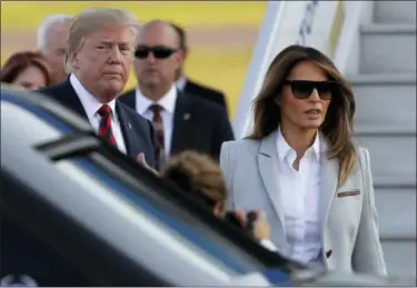  ?? MARKUS SCHREIBER — THE ASSOCIATED PRESS ?? U.S. President Donald Trump, left, and his wife Melania arrive at the airport in Helsinki, Finland, Sunday on the eve of his meeting with Russian President Vladimir Putin.