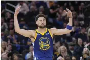  ?? THEARON W. HENDERSON — GETTY IMAGES ?? Klay Thompson (11) of the Golden State Warriors reacts during the fourth quarter against the Houston Rockets at Chase Center on Friday in San Francisco.