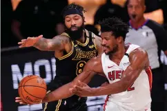  ?? Associated Press ?? ■ Miami Heat guard Andre Iguodala (28) celebrates Friday after scoring against the Los Angeles Lakers during the second half in Game 5 of basketball's NBA Finals in Lake Buena Vista, Fla.