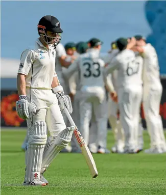  ?? AP ?? Kane Williamson slumps off the MCG after his dismissal late on day two which left the Black Caps in big trouble.
Neil Wagner got the better of Steve Smith again but New Zealand spinner Mitchell Santer, right, continues to struggle. GETTY IMAGES