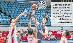  ?? —PBA IMAGES ?? Converge bright spot Justin Arana (with ball) soars for a layup against Phoenix defenders.