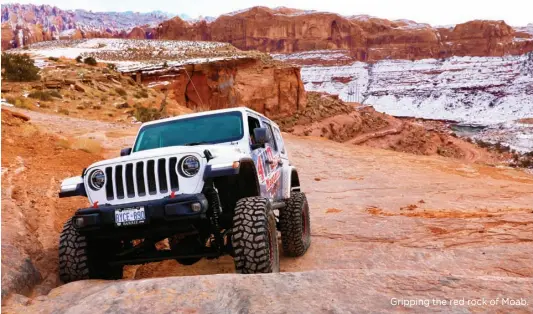  ??  ?? Gripping the red rock of Moab.