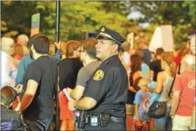  ?? BARRY TAGLIEBER — FOR DIGITAL FIRST MEDIA ?? Phoenixvil­le Police Lt. Brian Marshall was part of the strong police presence at Friday’s anti-hate rally.