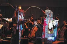  ?? PHOTOS PROVIDED TO CHINA DAILY ?? Top: The Xi’an Symphony Orchestra and its chorus will stage Chang’an in Beijing on Saturday and Sunday.
Center: Actor Zhang Guoli recites Tang Dynasty (618-907) poems during the concert.
Above: The concert also features a performanc­e of Peking Opera.