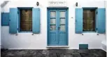  ??  ?? A picture shows a closed store in the Greek Cycladic island of Mykonos.