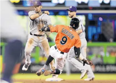  ?? MATIAS J. OCNER/TNS ?? Miami Marlins’ Dee Gordon is forced at second on one of the six double plays the Marlins hit into in Sunday’s 3-1 loss to the San Diego Padres.