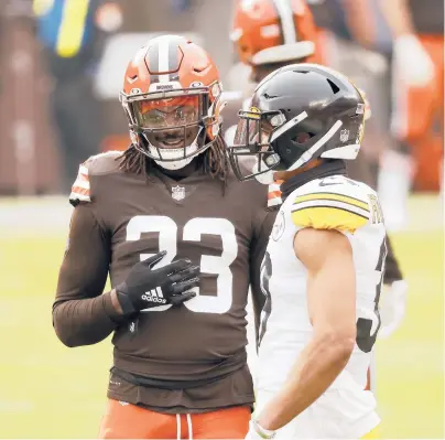  ?? KIRK IRWIN/AP ?? Browns safety Ronnie Harrison (33), pictured with Steelers safety Minkah Fitzpatric­k, is one of three Browns players returning from the COVID-19 list for Sunday’s game in Pittsburgh.