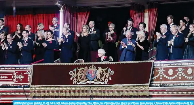  ??  ?? LONDON: Britain’s Queen Elizabeth II (C), with (Left to right) Catherine, Duchess of Cambridge, Prince William, Duke of Cambridge, Prince Edward, Earl of Wessex, Sophie, Countess of Wessex, Birgitte, Duchess of Gloucester, Sir Tim Laurence, Prince Charles, Prince of Wales, Princess Anne, Princess Royal, Camilla, Duchess of Cornwall, Prince Andrew, Duke of York, Prime Minister Boris Johnson, Prince Harry, Duke of Sussex, Meghan, Duchess of Sussex and Carrie Symonds attend the annual Royal British Legion Festival of Remembranc­e at the Royal Albert Hall. —AFP