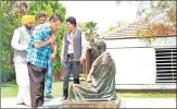  ?? TWITTER ?? Delhi chief minister Arvind Kejriwal and his Punjab counterpar­t Bhagwant Mann pay tribute to Mahatma Gandhi at the Sabarmati Ashram on Sunday.