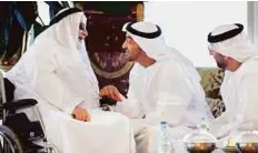  ?? WAM ?? Shaikh Mohammad with Abdullah Al Sayyed Al Hashemi, a former Abu Dhabi Government employee, during a reception at Sea Palace, yesterday.