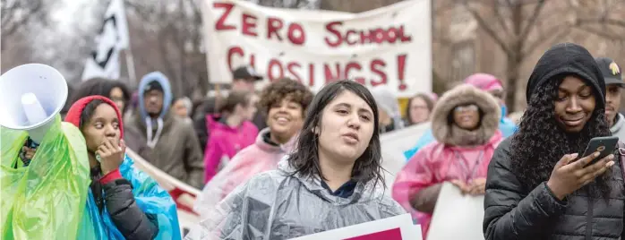  ?? ERIN BROWN/ SUN- TIMES ?? Melody Cruz, an eighth- grader at Richard Yates Elementary, marched with hundreds of protesters in February to oppose the closings of five Chicago public schools.