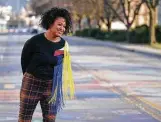  ?? Darron Cummings / Associated Press ?? Malina Jeffers looks at the Black Lives Matter street mural, now wearing away, stretching across Indiana Avenue, in Indianapol­is.