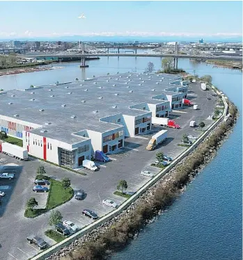  ??  ?? A rendering depicts PC Urban’s project on Mitchell Island in Richmond dubbed IntraUrban Rivershore, which will feature industrial strata units designed for small businesses that average about 10,000 square feet each.