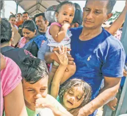  ??  ?? Doomed to be turned away: Migrants in the caravan headed for the US border.