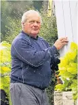  ??  ?? Michael Legg has filled the garden of his home with old windows and doors