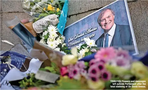  ?? ?? TRIBUTES: Flowers and messages left outside Parliament after the fatal stabbing of Sir David Amess.