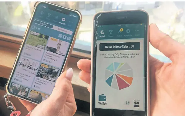  ?? FOTO: RONGE ?? So sieht die Klima-Taler-App auf dem Handy aus. Sie zeigt an, wie viel CO2 eingespart wurde und was man mit den erworbenen Talern anfangen kann.