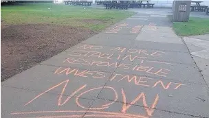  ??  ?? Pictured are chalk messages in the courtyard.