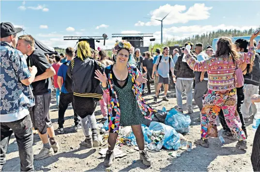  ??  ?? Revellers at an illegal rave that started in the early hours of yesterday, near the village of Banwen, South Wales. Police were called to break up the event after local residents complained