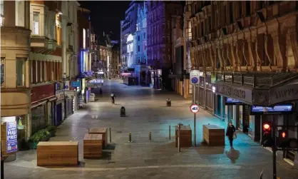  ?? Photograph: David Levene/The Guardian ?? ‘Covid-19 triggered shutdowns of society on a scale unseen since the 1918 influenza pandemic.’ An empty Leicester Square in London in March 2020.