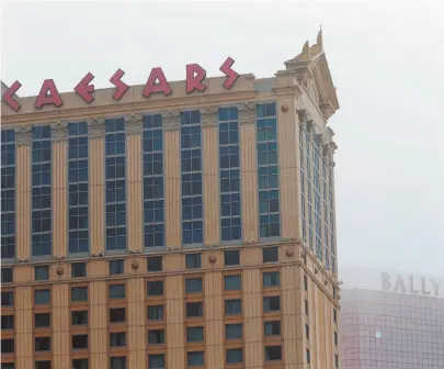  ?? AP FILE PHOTO/SETH WENIG ?? In this 2017 file photo, a sign for Caesars Atlantic City Hotel and Casino is seen in Atlantic City, N.J. Caesars Entertainm­ent told The Associated Press on Friday that it will check its guests’ hotel rooms every 24 hours, even if they have a Do Not...