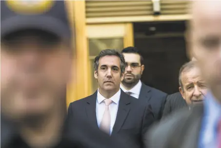  ?? Jeenah Moon / New York Times ?? Michael Cohen leaves federal court in New York. His lawyers have two weeks to complete a review of data seized by the FBI.