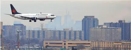  ??  ?? An Air Canada Boeing 737 MAX 8 jet approaches Toronto Pearson Internatio­nal Airport on March 13 in Toronto, Canada. Several countries, including the U.S., Canada, China and Australia have grounded the jets. COLE BURSTON / GETTY IMAGES