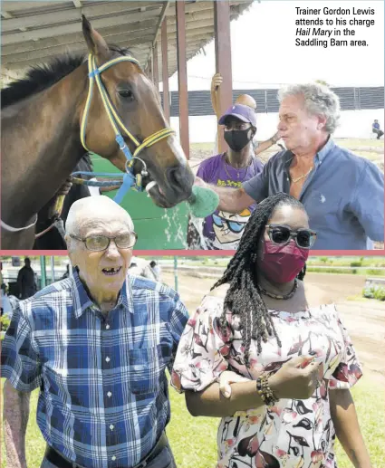  ?? ?? Trainer Gordon Lewis attends to his charge Hail Mary in the Saddling Barn area.
Lorna Gooden,svrel’sgeneral Manager, with retried vet Dr John Masterton in the winners’ enclosure.