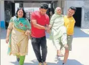  ?? HARPREET KAUR/HT PHOTO ?? An elderly voter being taken to a polling booth in Hoshiarpur on Sunday.