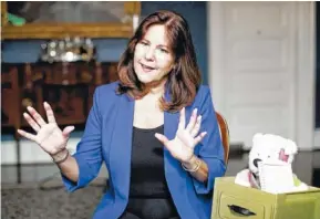  ?? AP PHOTO/CAROLYN KASTER ?? Karen Pence sits next to a Comfort Crew Kit to be given to a military child during an interview with The Associated Press at the Vice President’s residence, the Naval Observator­y, in Washington.