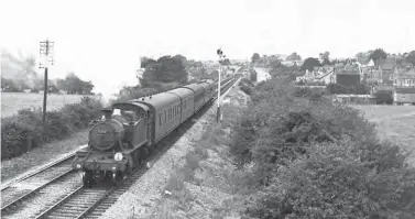 ?? S Rickard/J & J Collection ?? Less than five miles into its return journey, Treherbert-based Collett ‘5101’ class 2-6-2T No 5159 accelerate­s away from Dinas Powis station with the 10.30am Barry Island to Treherbert stopping passenger train, target TA. The writing was on the wall for this 1930-built engine as it would be withdrawn from Treherbert (88F) in mid-April 1956 and broken up at Swindon Works about a month later.
