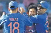  ?? AFP ?? ■ Kuldeep Yadav (centre) celebrates his careerbest figures of 5/24 in the first T20 on Tuesday.