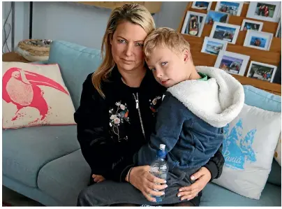  ??  ?? Robyn McLean exhorted her son Enzo, 7, to drink plenty of water, not knowing the town supply was contaminat­ed.