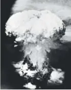  ??  ?? A massive column of billowing smoke, thousands of feet high, mushrooms over Nagasaki, Japan, after the United States dropped an atomic bomb on Aug. 9, 1945. AP Photo/U.S.Signal Corps