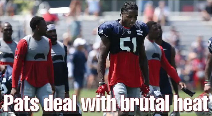  ?? NANCY LANE / BOSTON HERALD ?? LIKE AN OVEN: Patriots rookie Joejuan Williams (51) leaves the field after yesterday’s hot training camp practice at Gillette Stadium in Foxboro.